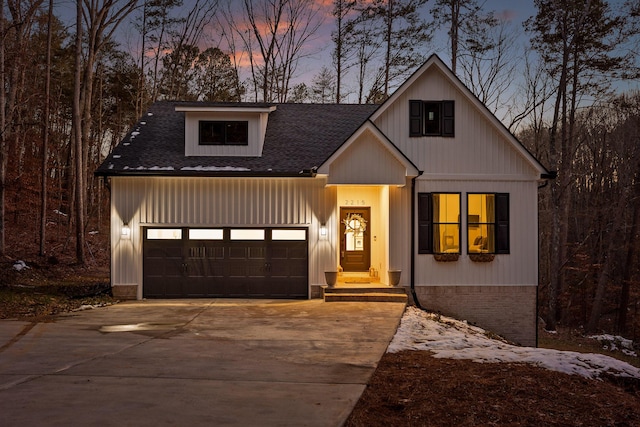 modern inspired farmhouse featuring a garage