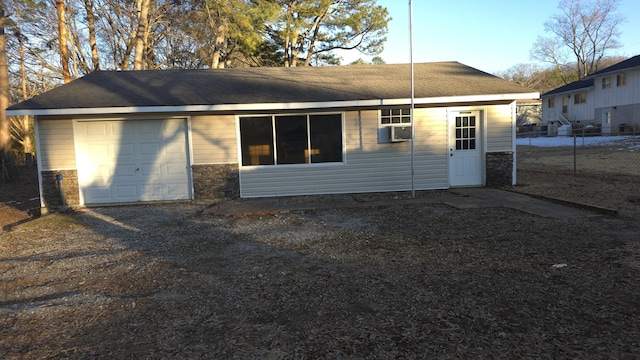 rear view of house with cooling unit