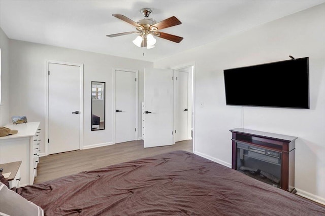 unfurnished living room with hardwood / wood-style floors and ceiling fan