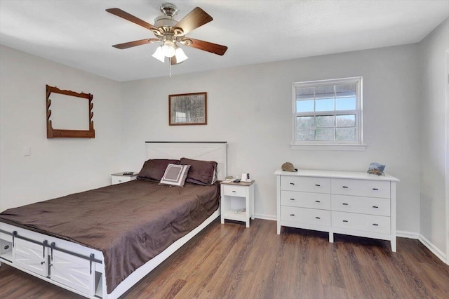 bedroom featuring dark hardwood / wood-style flooring and ceiling fan