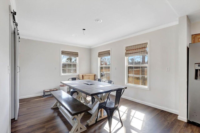 dining area with crown molding and dark hardwood / wood-style floors