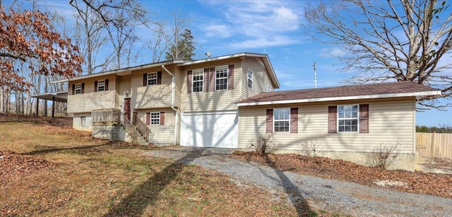 rear view of property with a garage