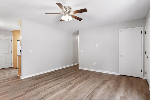 empty room featuring light hardwood / wood-style floors and ceiling fan