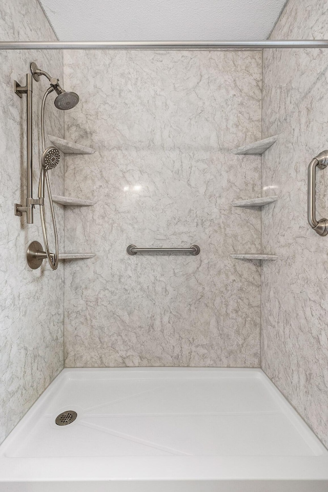 bathroom with a tile shower