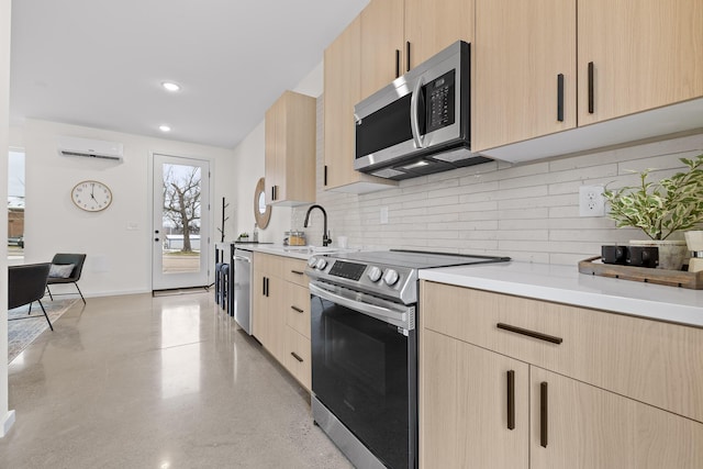 kitchen with a wall mounted air conditioner, backsplash, sink, light brown cabinetry, and appliances with stainless steel finishes