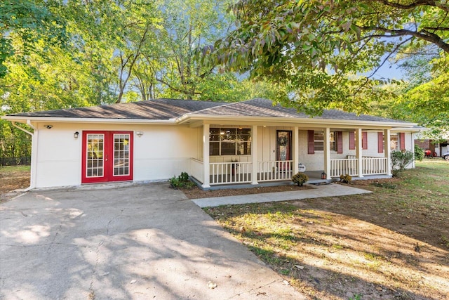 ranch-style home with french doors and a porch