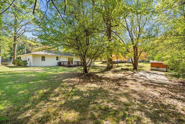 view of yard featuring a wooden deck