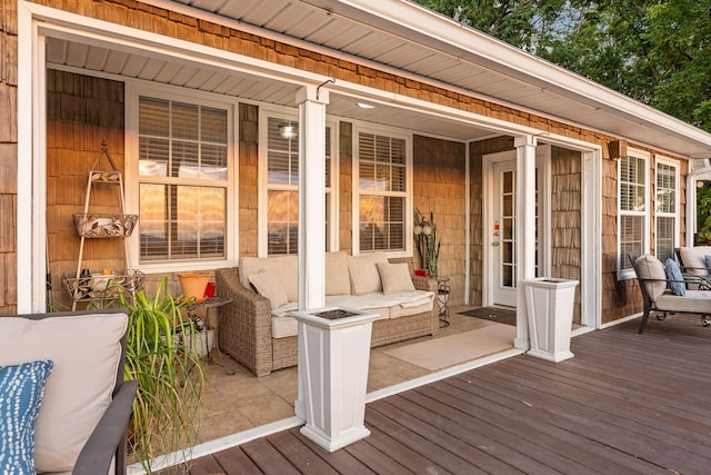 wooden deck with an outdoor hangout area