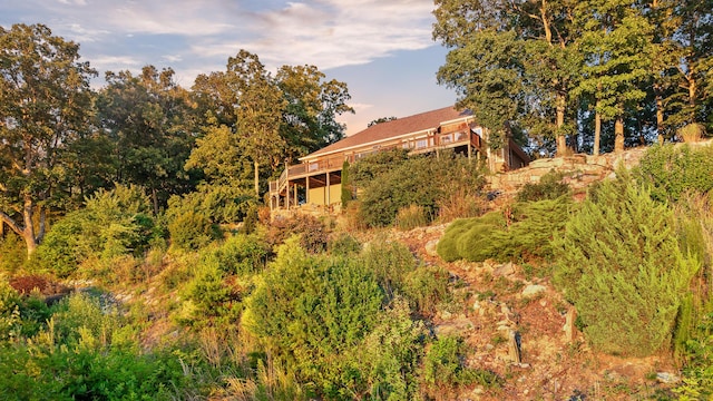 back of house with a wooden deck