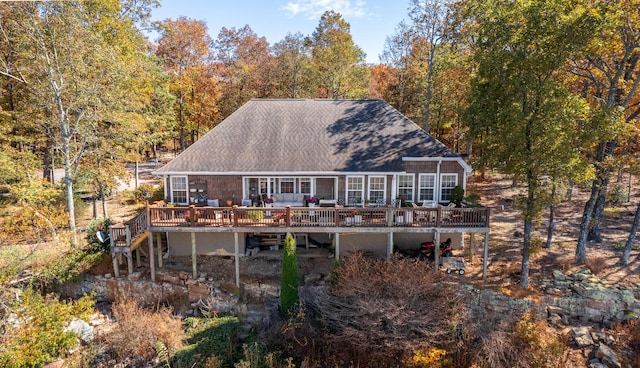 back of house with a wooden deck