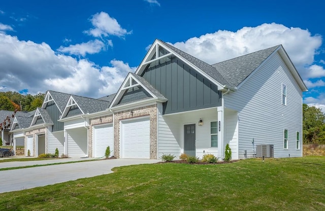 view of front of property featuring a garage and a front lawn