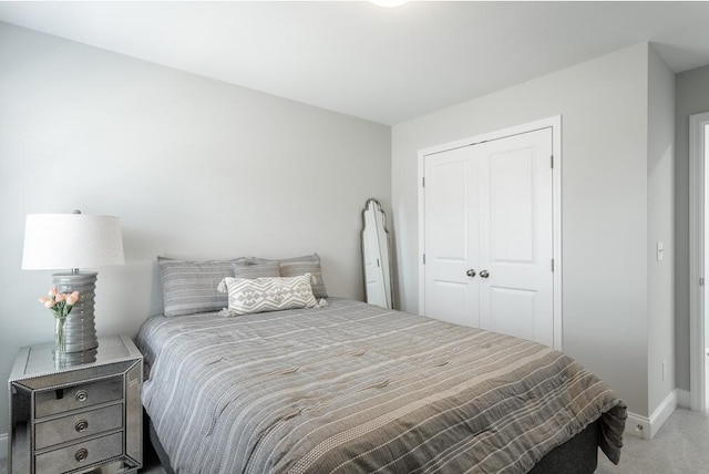 carpeted bedroom with a closet