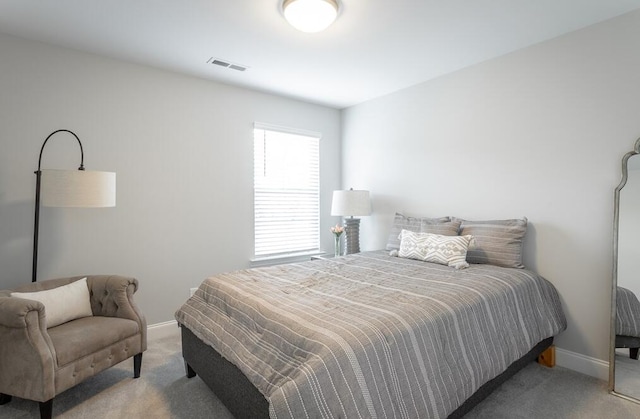 bedroom with light colored carpet