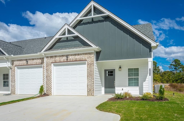 view of front facade with a garage and a front lawn