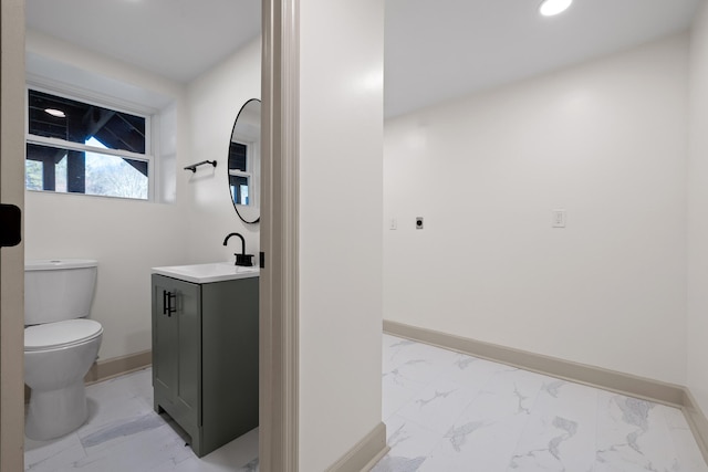 bathroom featuring toilet and vanity