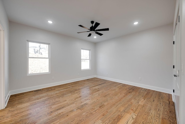 unfurnished room featuring ceiling fan and light wood-type flooring