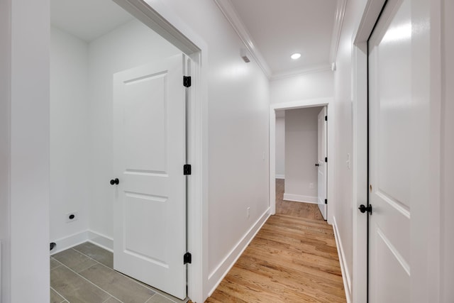 hall featuring hardwood / wood-style floors and ornamental molding