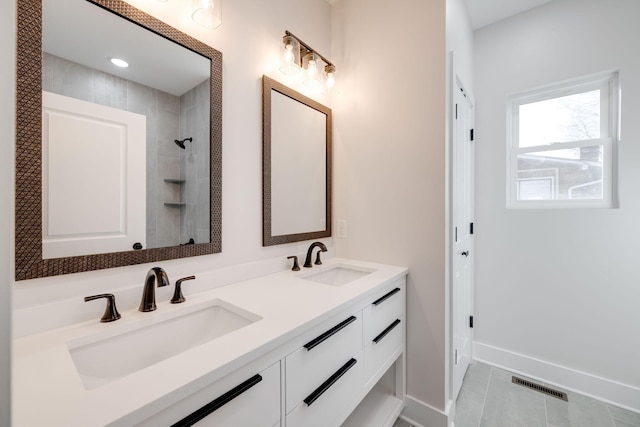 bathroom featuring vanity and tile patterned flooring