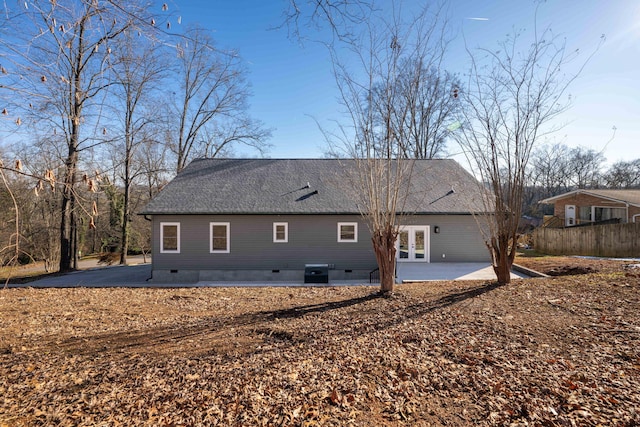 rear view of house with central AC, french doors, and a patio