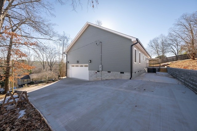 view of side of property featuring a garage