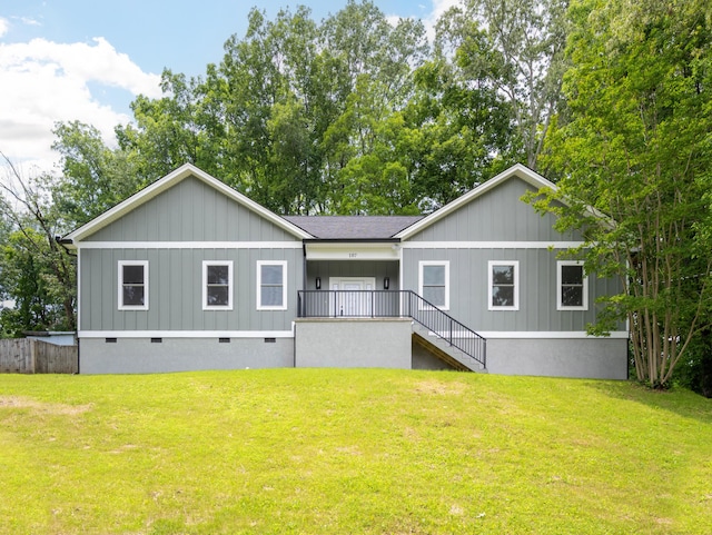 107 Douglas Dr, Chattanooga, TN 37412 - rear view of property featuring crawl space, a lawn, stairs, and board and batten siding