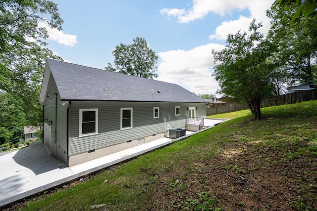 107 Douglas Dr, Chattanooga, TN 37412 - back of house featuring a patio area, central AC unit, and a shingled roof