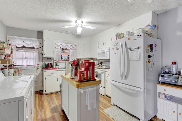 kitchen with white appliances, light hardwood / wood-style flooring, a textured ceiling, ceiling fan, and white cabinets