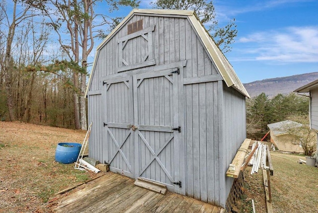 view of outbuilding featuring a mountain view