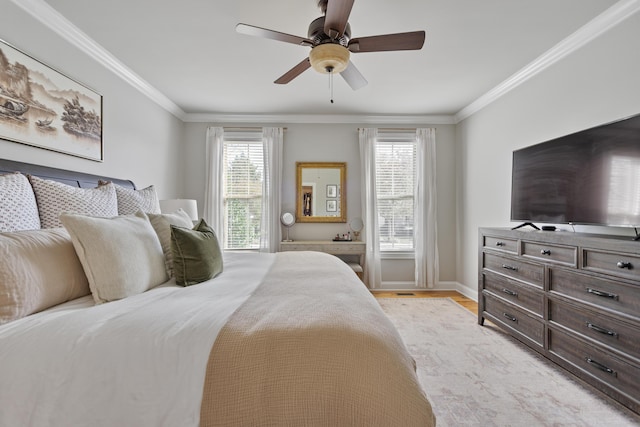 bedroom with ceiling fan, crown molding, and light hardwood / wood-style flooring