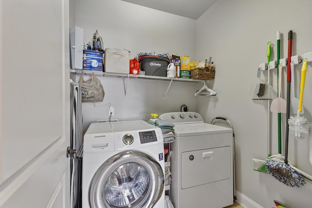 washroom with washer and clothes dryer