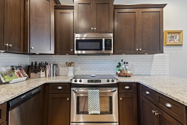 kitchen featuring backsplash, appliances with stainless steel finishes, and dark brown cabinets