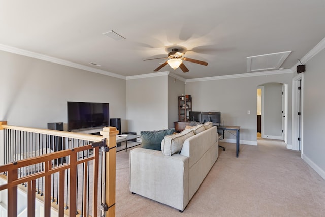 living room with ceiling fan, crown molding, and light colored carpet