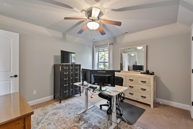 office area featuring ceiling fan, light colored carpet, and lofted ceiling