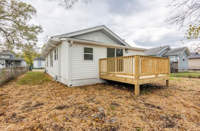 back of house featuring a deck