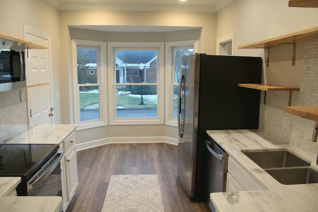 kitchen with sink, stainless steel appliances, dark hardwood / wood-style floors, and white cabinetry