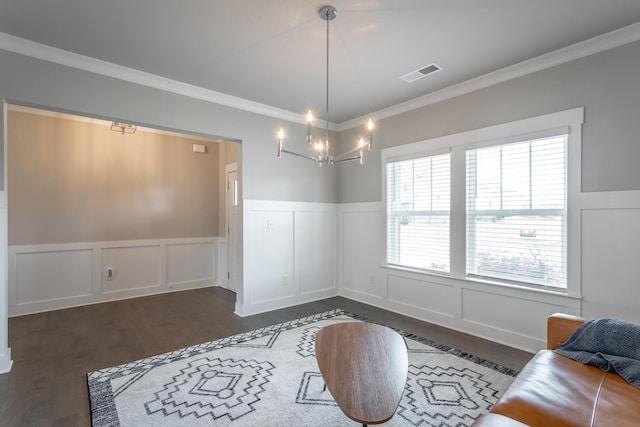 dining space featuring a notable chandelier, ornamental molding, and dark hardwood / wood-style flooring