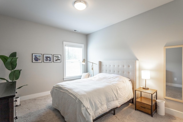 bedroom with light colored carpet