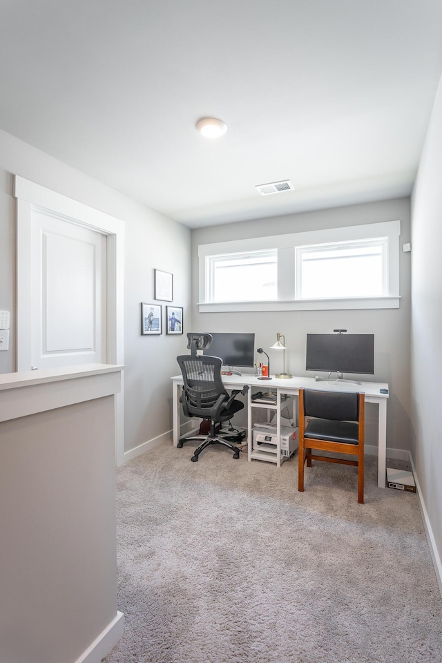 office space featuring light carpet and a wealth of natural light