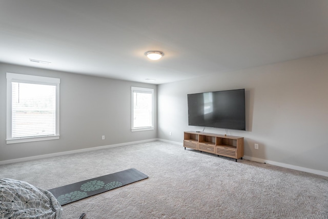 unfurnished living room featuring carpet