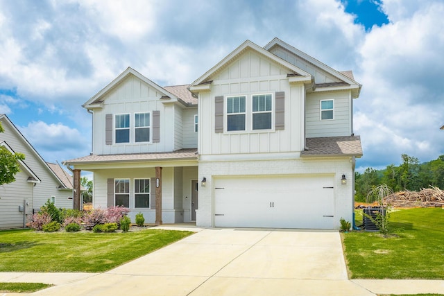 craftsman house featuring a front yard and a garage