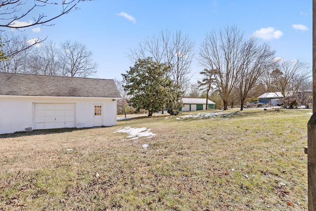 view of yard with a garage