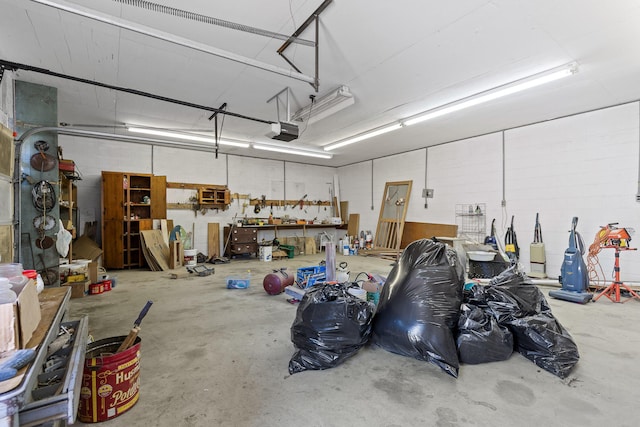 garage featuring a workshop area and a garage door opener