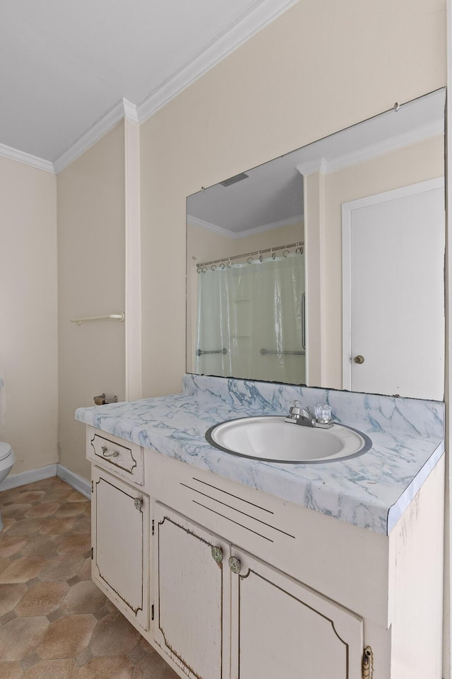 bathroom with toilet, vanity, crown molding, and a shower with curtain