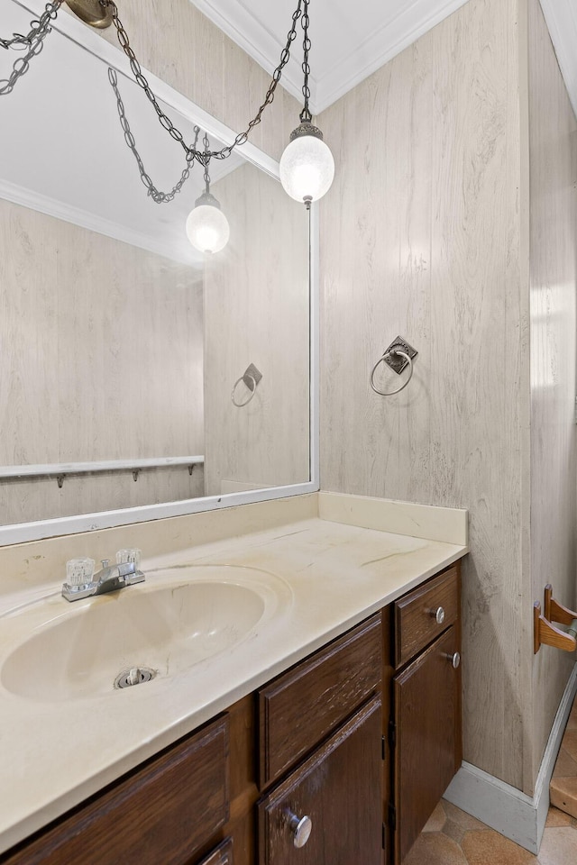 bathroom with vanity and ornamental molding