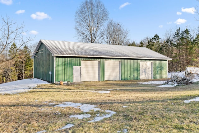 view of outbuilding with a yard and a garage