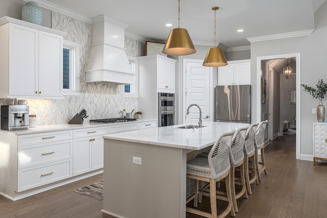 kitchen featuring dark wood-type flooring, a sink, custom range hood, appliances with stainless steel finishes, and crown molding