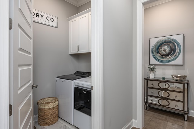 washroom with cabinet space and independent washer and dryer