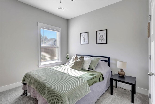 bedroom featuring light colored carpet