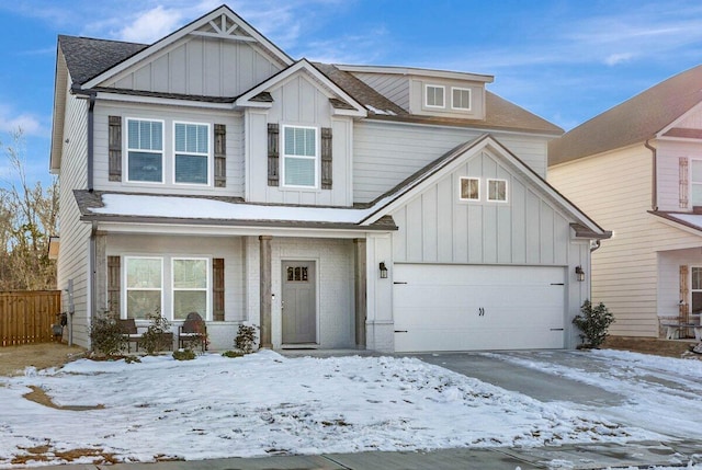 view of front of property with a porch and a garage