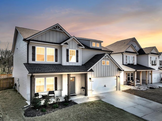 view of front of house featuring a porch, board and batten siding, and a shingled roof